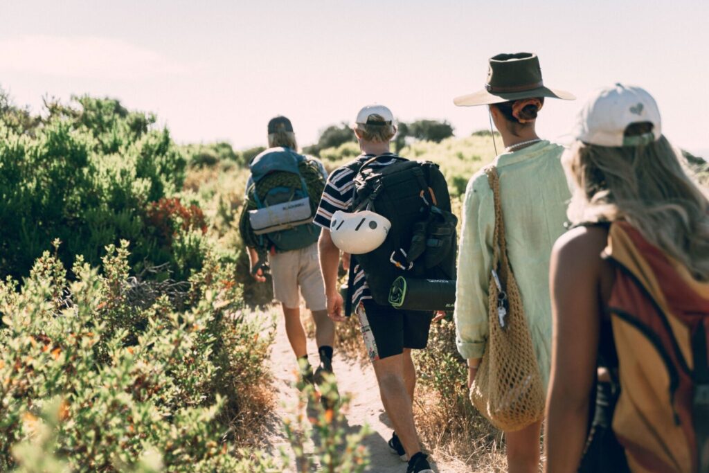 A group of friends hiking through vibrant summer trails, capturing the essence of outdoor adventure.