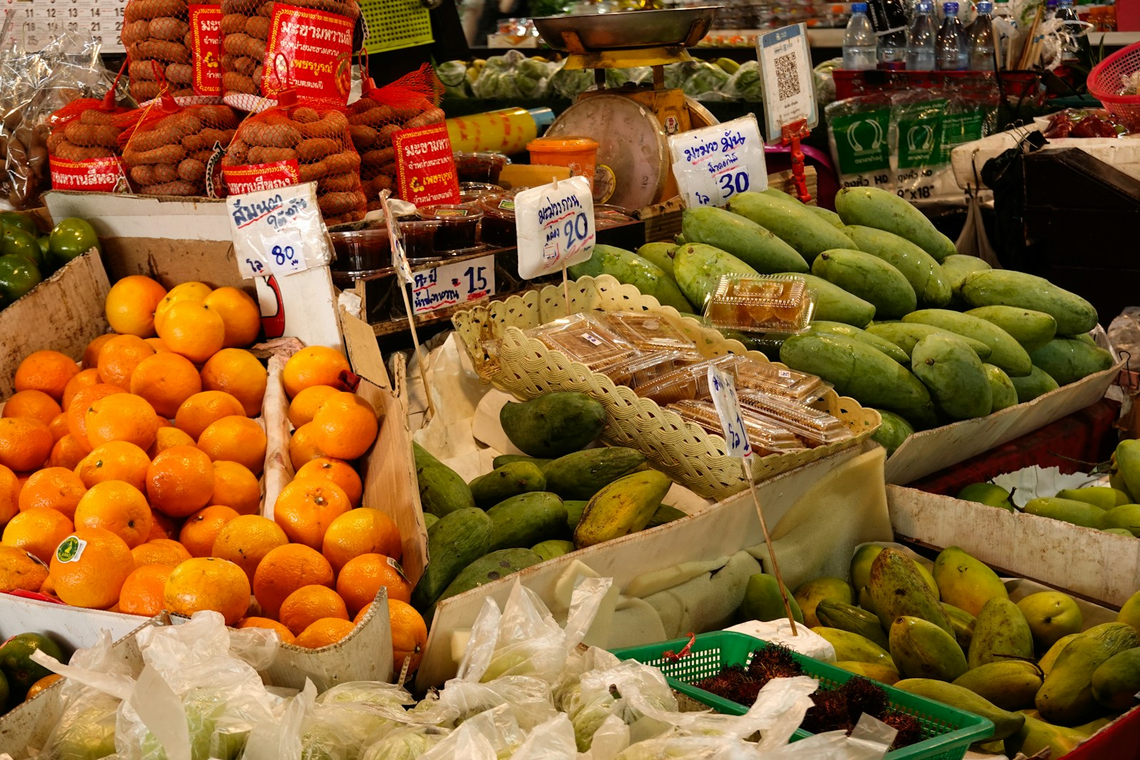 A vibrant market stall filled with fresh fruits and vegetables.